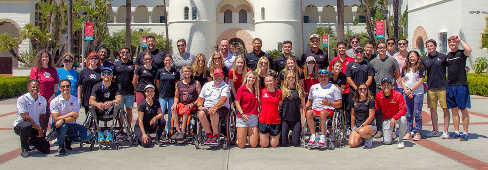 Group Photo of Adapted Athletics athletes and staff in front of Hepner Hall