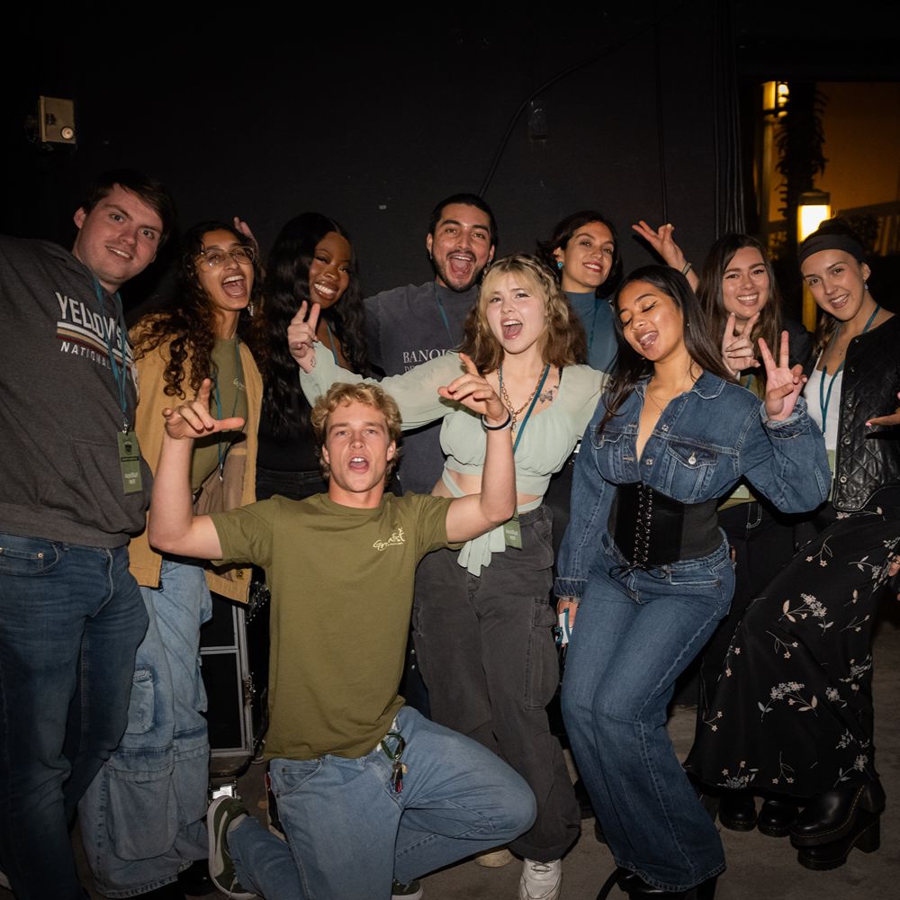 Smiling group of GreenFest Committee Members wearing GreenFest gear