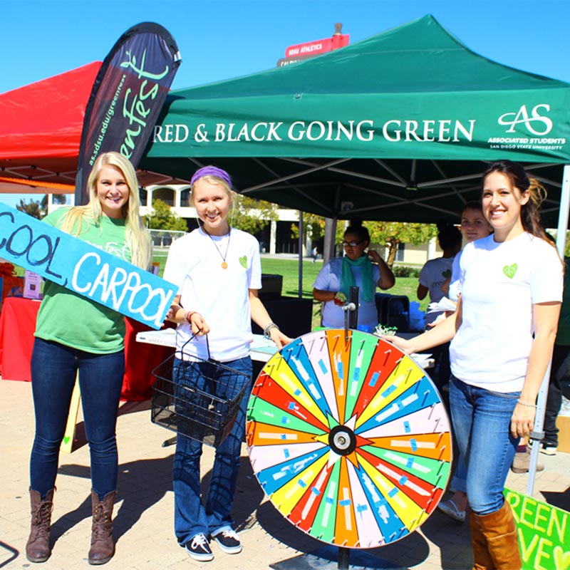 Students with prize wheel at a GreenFest event