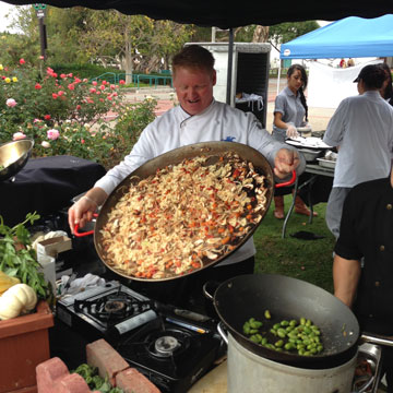 Chef holding giant pan