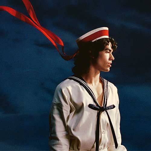  Conan Gray in a sailor outfit, blue backgrond  - Event