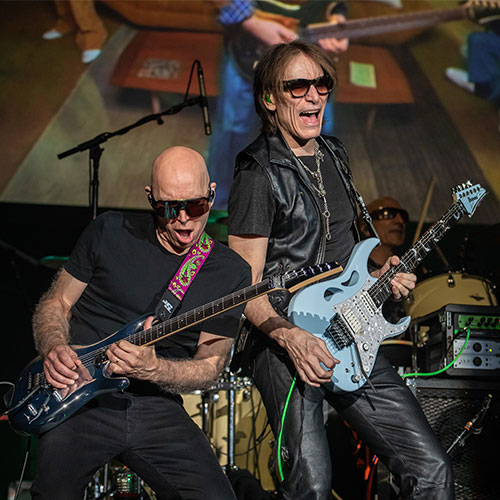  Two guitarists from Satch Vai Band performing on stage  - Event