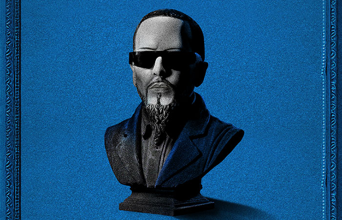 Illustration of Yandel as a bust/statue wearing sunglasses against blue background