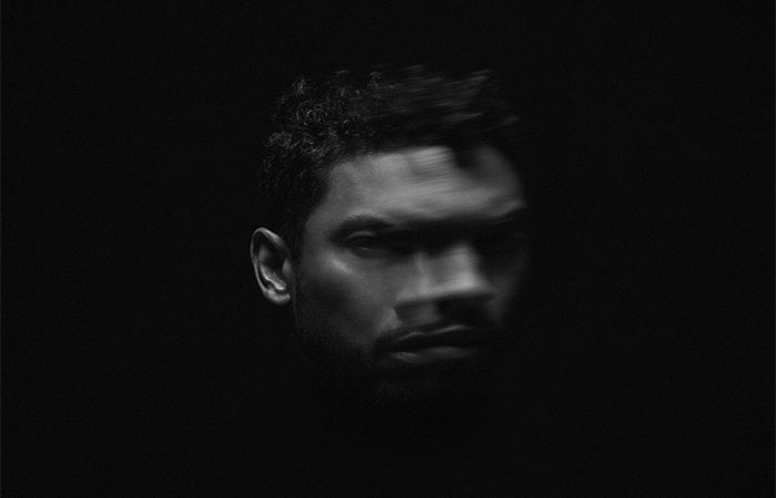 Miguel's face against black background Photo