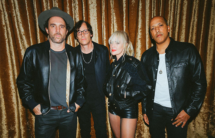 Metric band member group photo