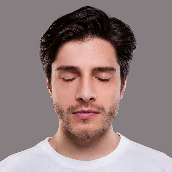 Photo of a man with her eyes closed