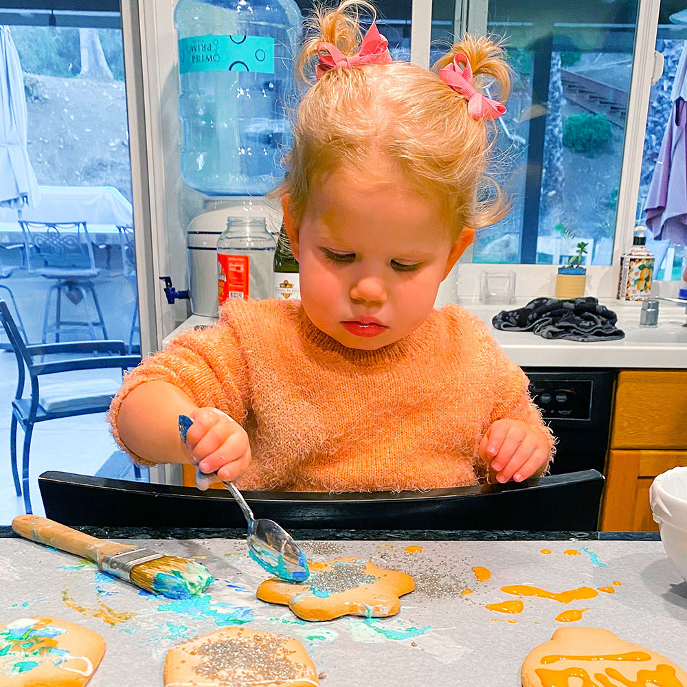 Mila decorating cookies