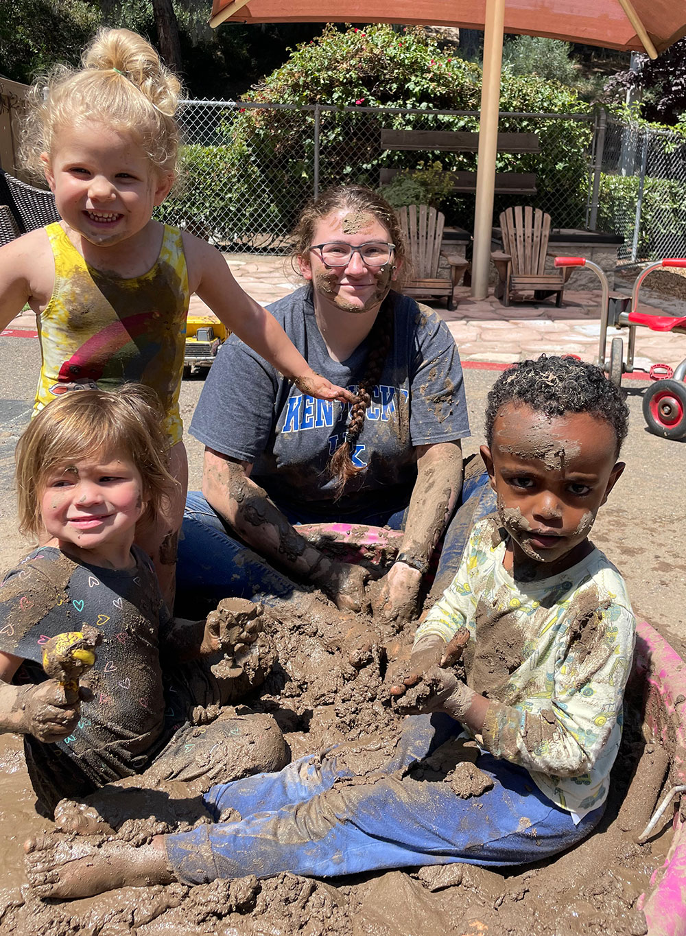 Children and their teacher playing in mud?2024-02-25