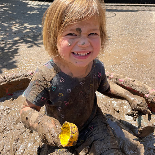 Child playing in mud