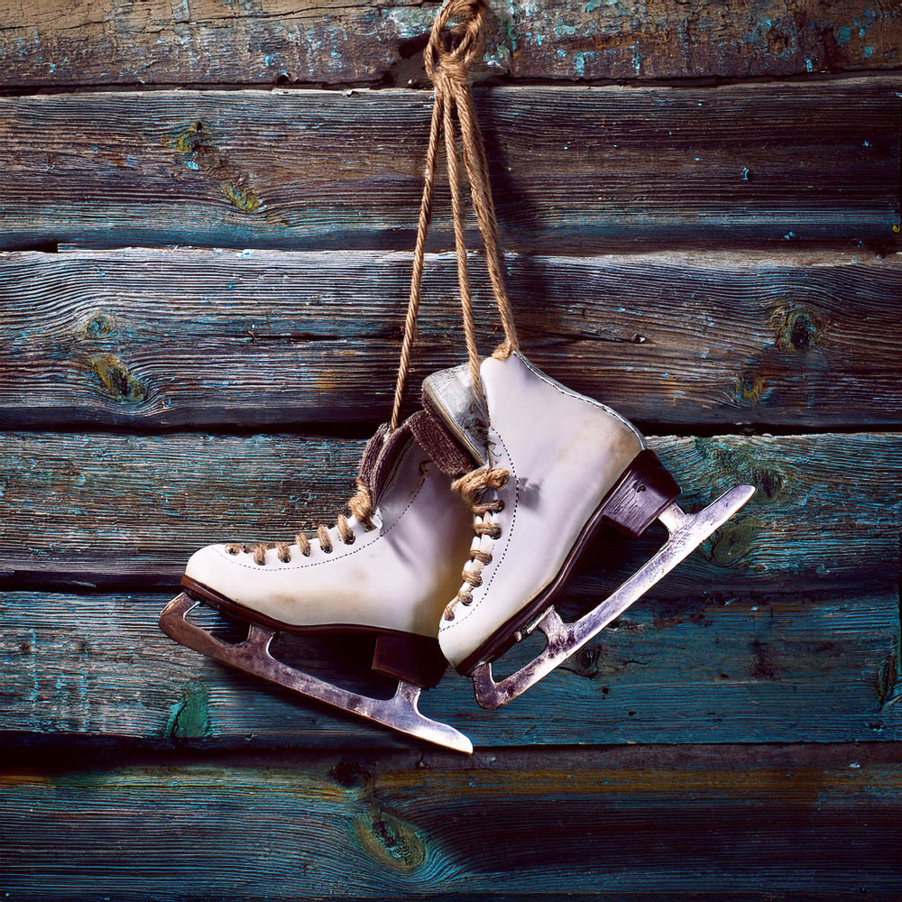 Ice skates hanging on a wall