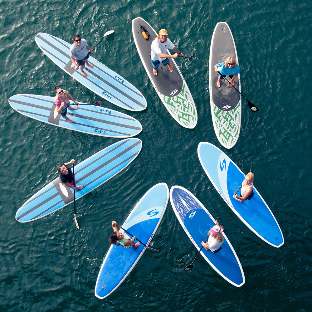 Members of Mission Bay Aquatic Center paddle boarding.