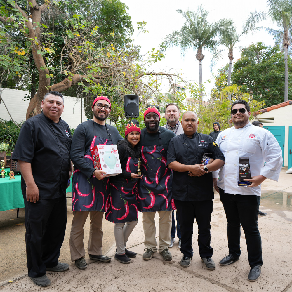 Team Chili Chili Bang Bang receiving an award and other prizes in the 2024 A.S. Chili Cook Off.