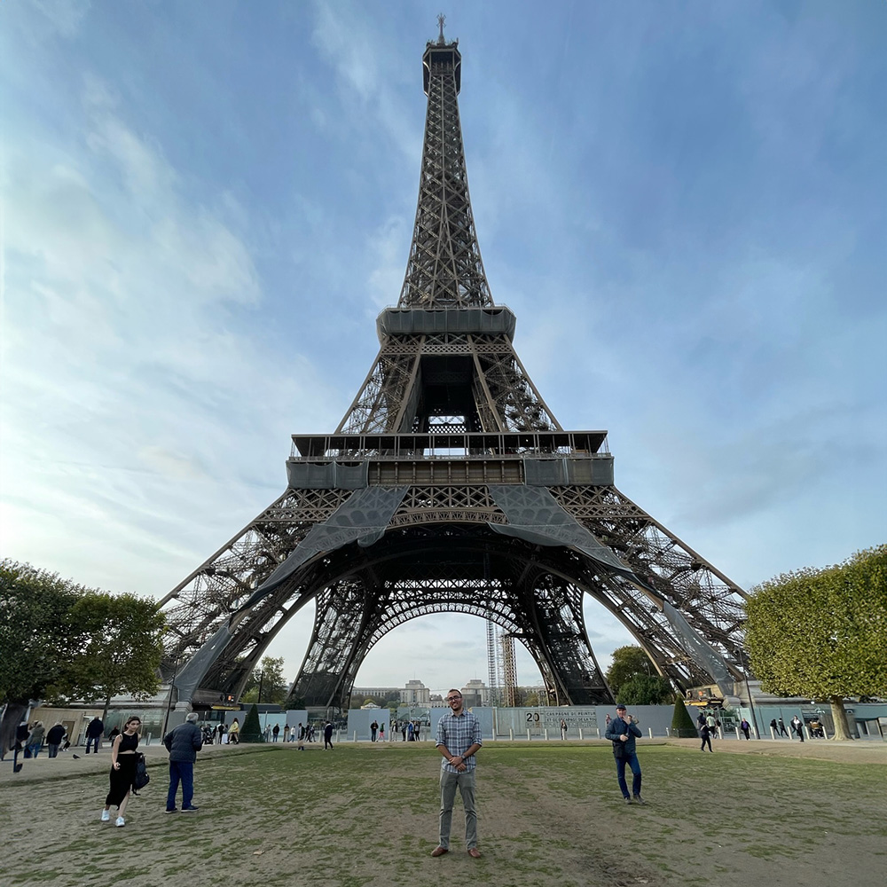 Sam in front of the Eiffel Tower.