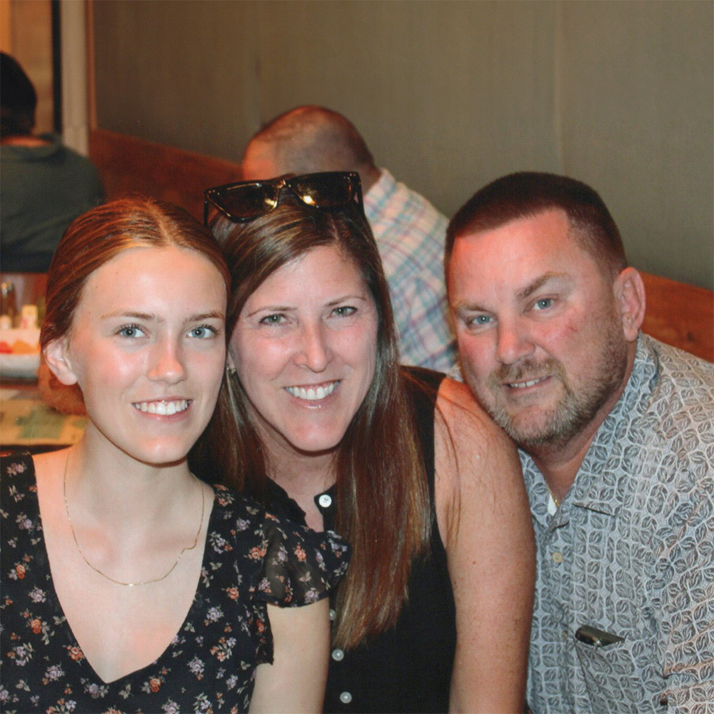 Tim and his family at a restaurant together.