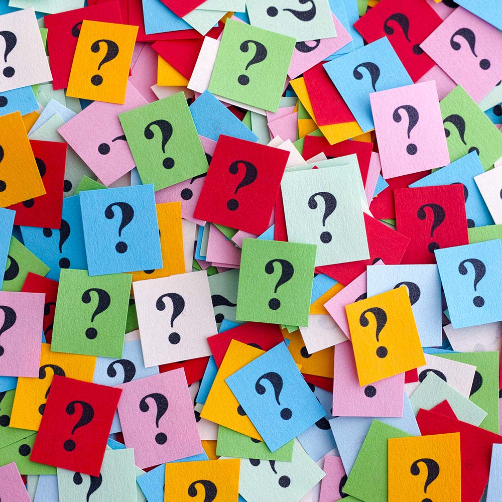 Square pieces of felt with question marks on them.
