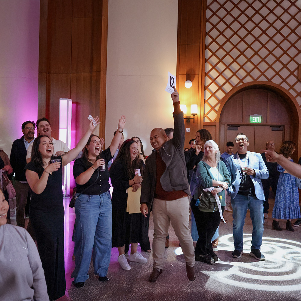 An auction winner celebrates his new purchase.