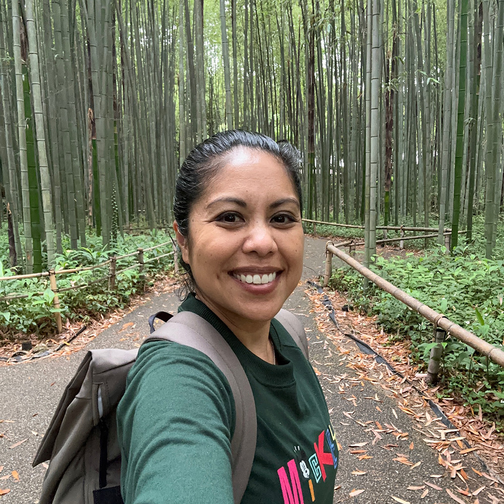 Janice on a trail in a bamboo forest.