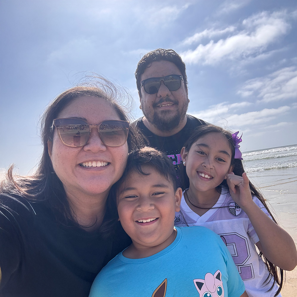 Michelle and her family enjoying a day together at the beach.